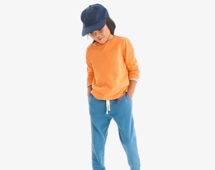 Boy wearing Primary French Terry Sweatpants - Moonlight. Available at www.tenlittle.com