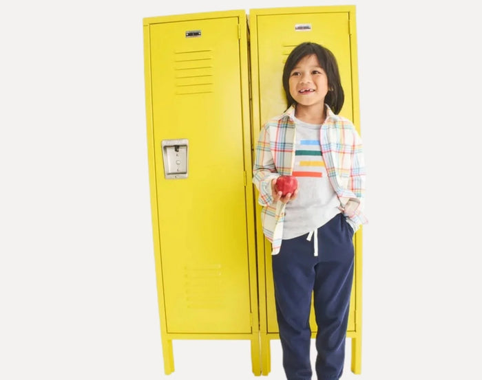 Boy at locker wearing Primary French Terry Sweatpants - Navy. Available at www.tenlittle.com