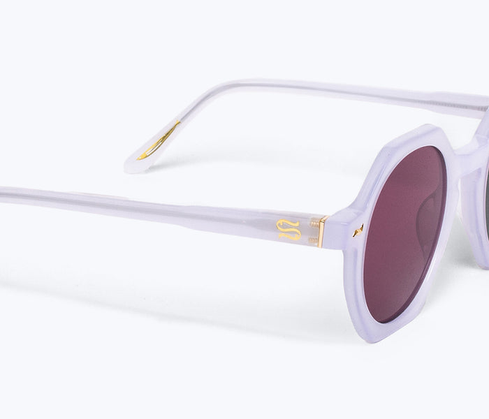 Freda Salvador FS X Sardine Millie sunglasses with orange-tinted lenses and stylish frame, shown from an angled view.