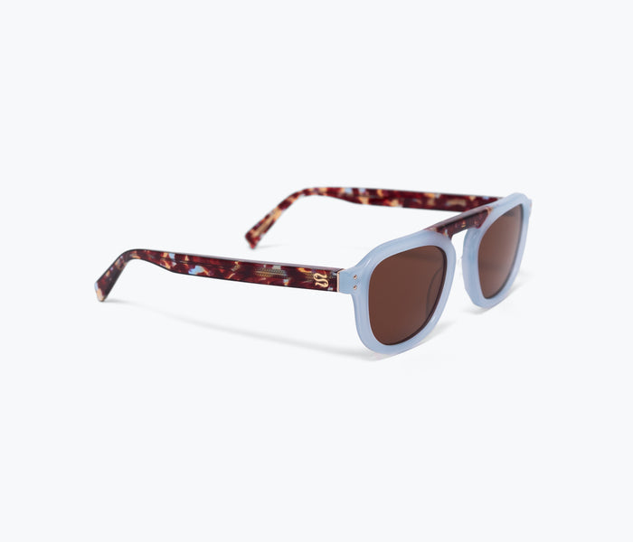 Blue and brown Stevie sunglasses by Sardine with rounded frames, shown from the right side.