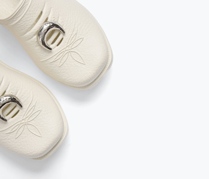 Close-up of Freda Salvador FS X Westech Outrider slip-on mule showing charming detailed stitching and sleek leather finish.