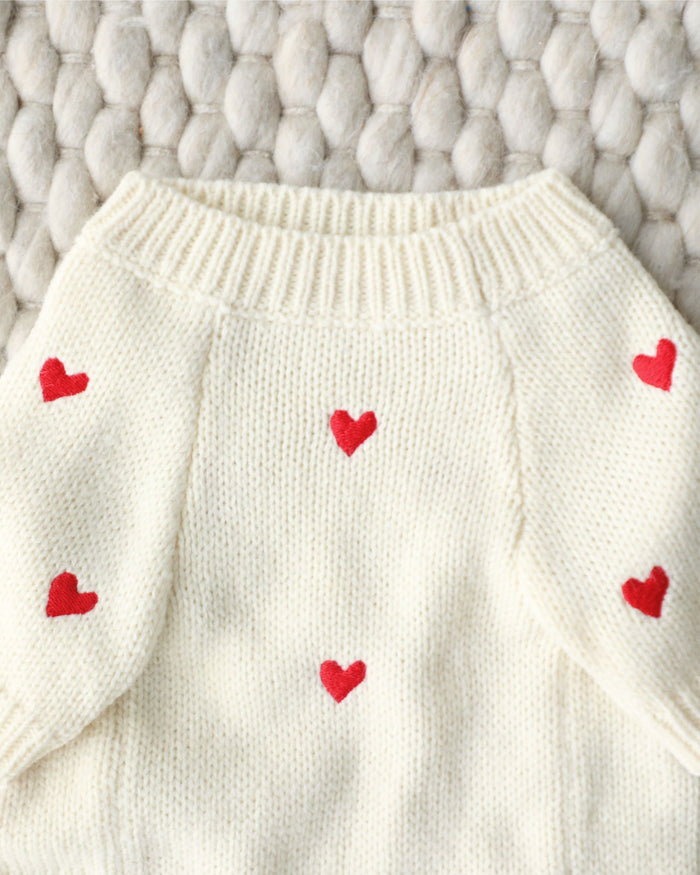 Small-medium dog Valentine’s sweater in festive red. Great fit for French Bulldogs, Mini Schnauzers, and Cavaliers.