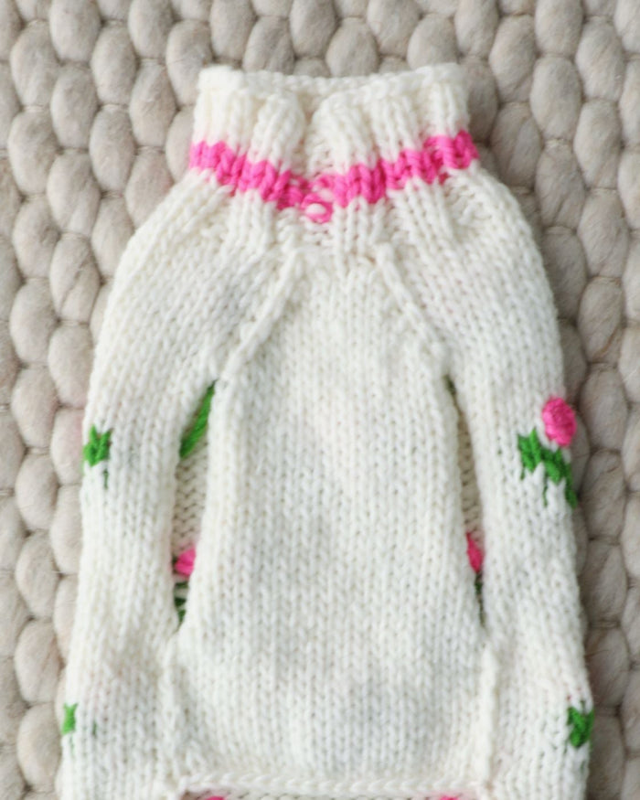 Floral patterned dog sweater blending warmth and timeless style, ideal for poodles and mixed breeds