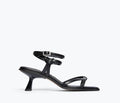 Black Freda Salvador Gianna strappy heeled sandal with calf-height straps, front view showing elegant design and heel detail.