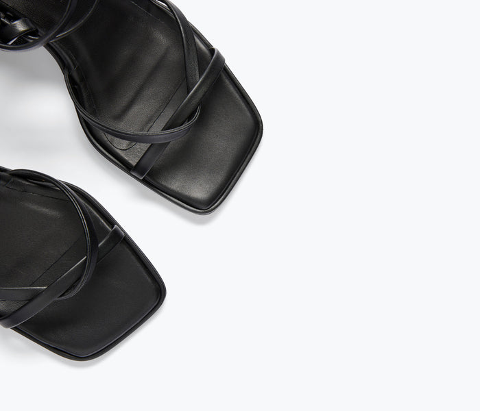 Black Freda Salvador Gianna strappy heeled sandal with calf detail, showcasing sleek design and elegant heel.