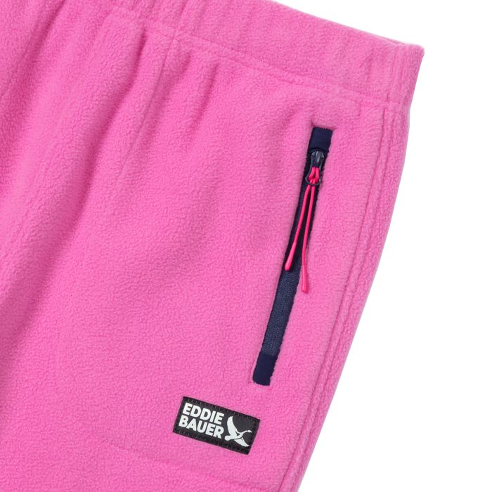 Pink fleece jogger with black zippered pocket and Eddie Bauer brand label.