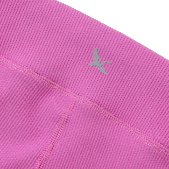 Bright pink ribbed leggings with green logo detail on waistband.