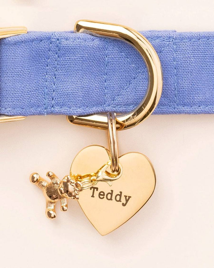 Cute teddy bear charm on a dog's collar, ideal for adding flair to small breed accessories.