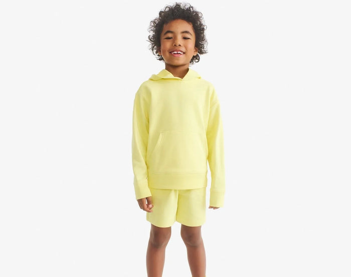 Child wearing Primary Gym Shorts - Buttercup. Available at www.tenlittle.com