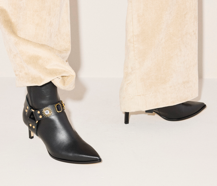 Black Freda Salvador Haden embellished ankle boot with decorative embellishments, showcasing stylish craftsmanship and sleek design.
