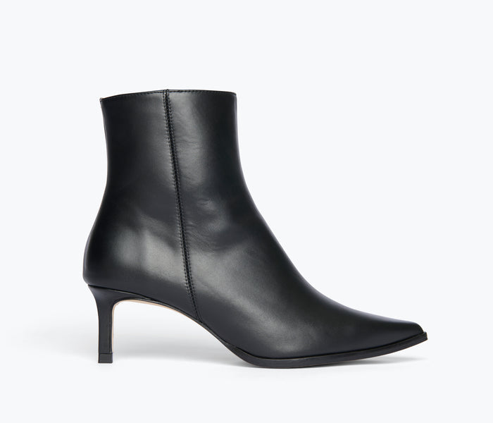 Freda Salvador Haden embellished black ankle boot with decorative accents, front view showing sleek leather design.