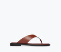 Fredas Salvador Halle leather thong sandal in chocolate brown, featuring a sleek front view with minimalist design.