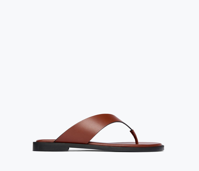 Fredas Salvador Halle leather thong sandal in chocolate brown, featuring a sleek front view with minimalist design.