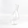 Handblown wine decanter by Nate Cotterman on white background.