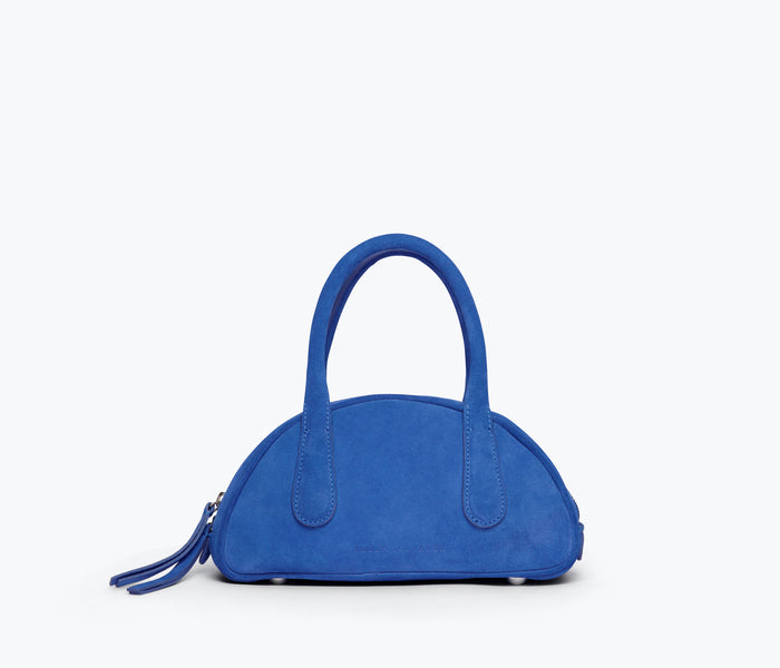 Freda Salvador Harlow Mini Bowling Bag in cobalt blue suede with front design and compact shape.