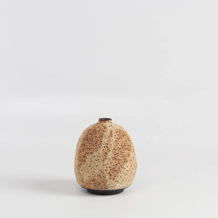 Striped cream to brown bottle  ceramic vase by Heather Rosenman on white background.