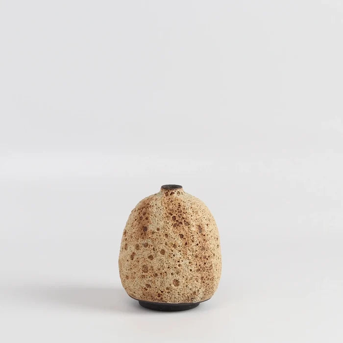 Striped cream to brown bottle  ceramic vase by Heather Rosenman on white background.