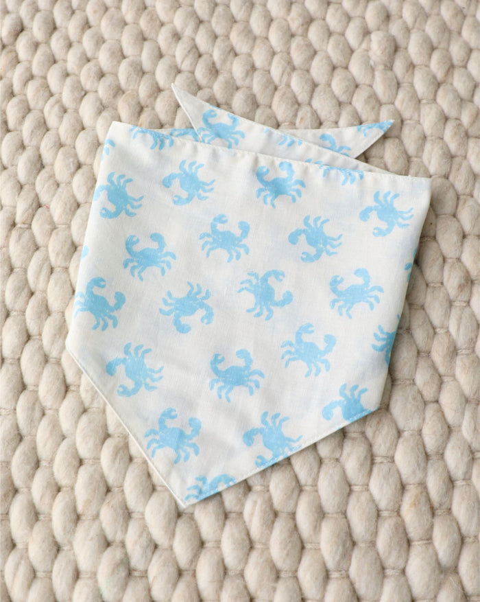 Small-medium dog crab bandana in blue. Fits Pugs, Cocker Spaniels, and Mini Schnauzers for playful summer adventures.