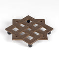A cast Iron lattice bottle trivet by Suzuki Morihisa. The Suzuki family, now in its 14th generation, started making Nambu Ironware in 1625. Made in Iwate, Japan.