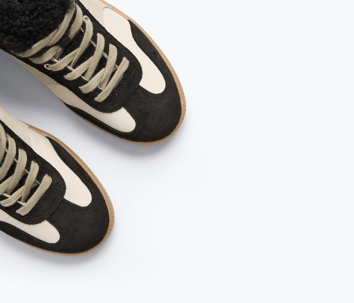 FREDA SALVADOR Jackie Court Sneaker in black suede with shearling detail, stylish casual footwear for women.