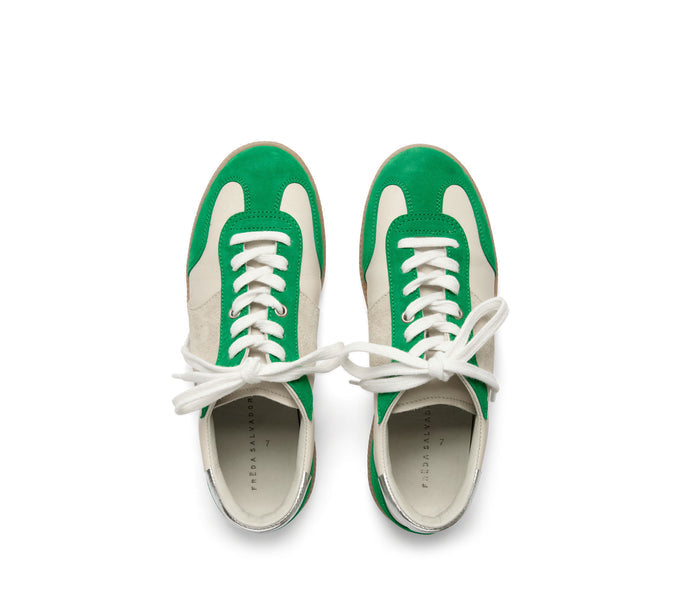 Green suede Jackie Court sneaker by Freda Salvador with white accents and a sleek, modern design.
