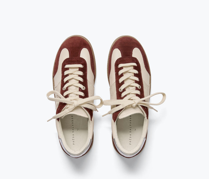 FREDA SALVADOR Jackie Court Sneaker with beige suede upper, white rubber sole, and stylish casual design.