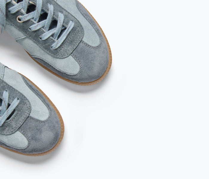 FREDA SALVADOR Jackie Sneaker in blue suede with mixed materials, featuring stylish design and comfortable sole detail.