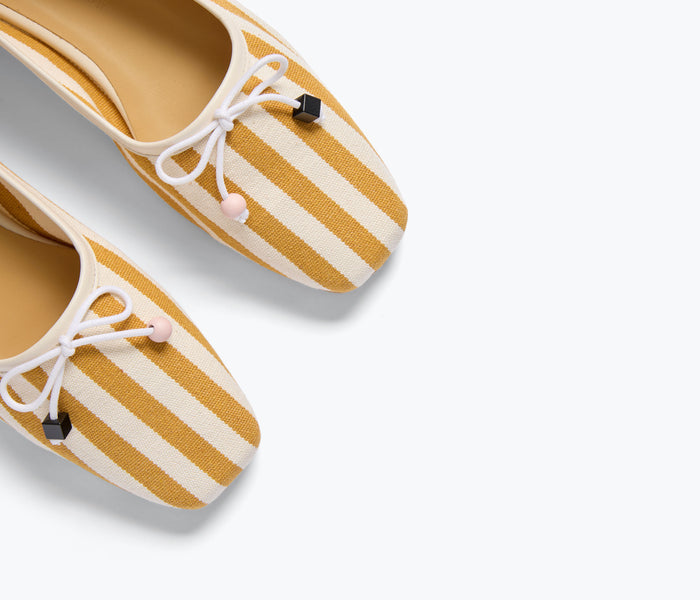 Freda Salvador JADA square toe ballet flat in mustard yellow and white canvas, featuring a sleek, minimalist design.