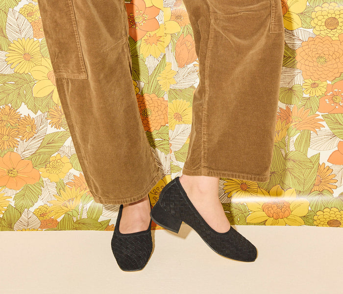 Black suede Jayla woven ballet heel by Freda Salvador, featuring a pointed toe and elegant woven detail.