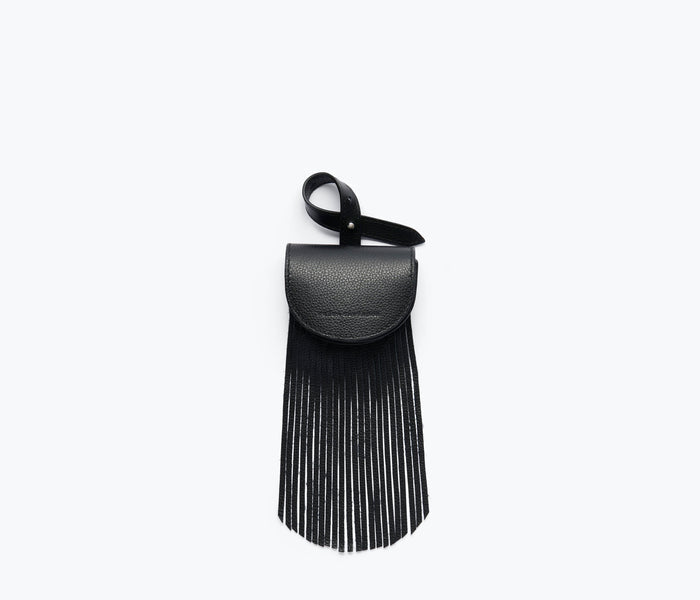 Black pebbled calf leather Joni fringe bag charm by Freda Salvador, featuring layered fringe details and elegant craftsmanship.