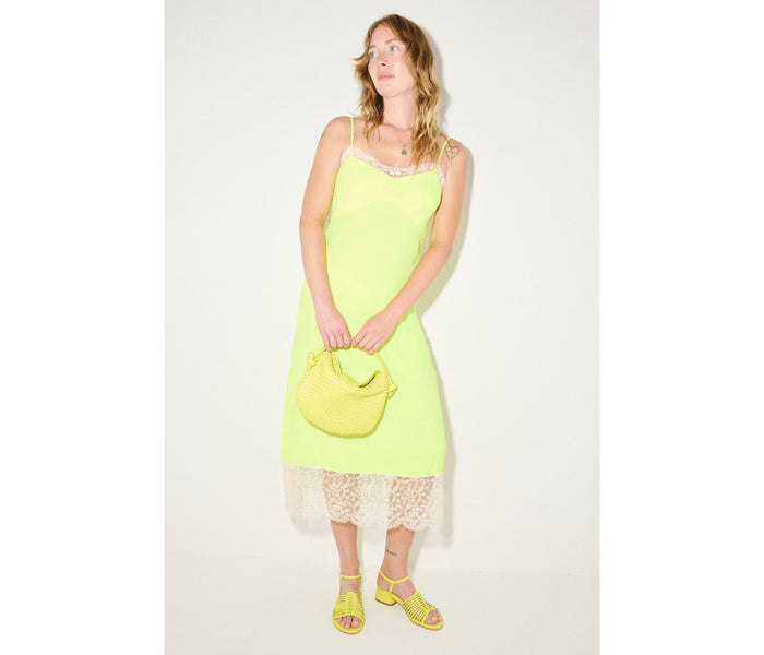 Freda Salvador Judy block-heeled sandal with neon-colored calf straps and a stylish heel, shown from a side angle.