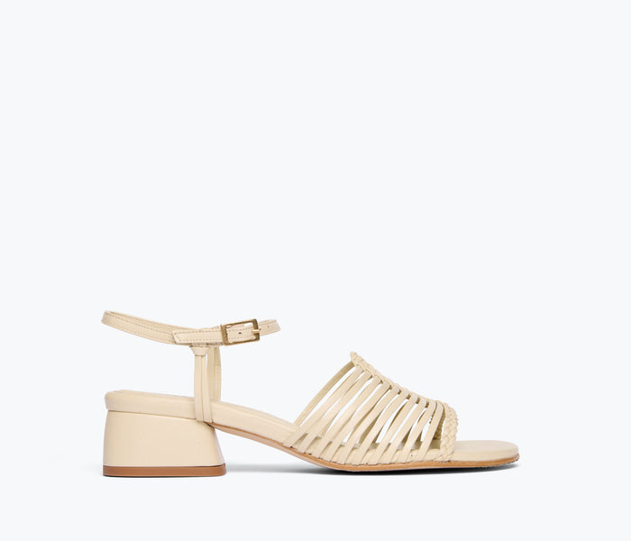 Freda Salvador Judy woven block heel sandal in vanilla calf leather, front view showing detailed woven strap design.