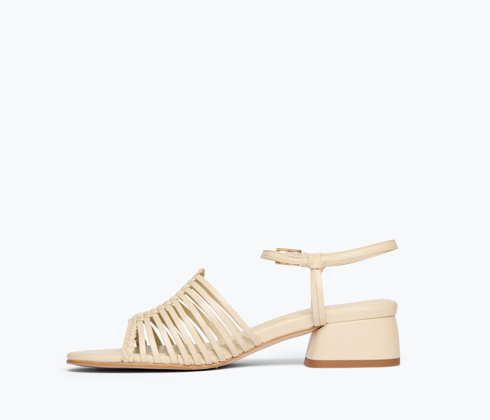 Freda Salvador Judy woven block heel sandal in vanilla calf leather, showing the inside view of the stylish heel shoe.