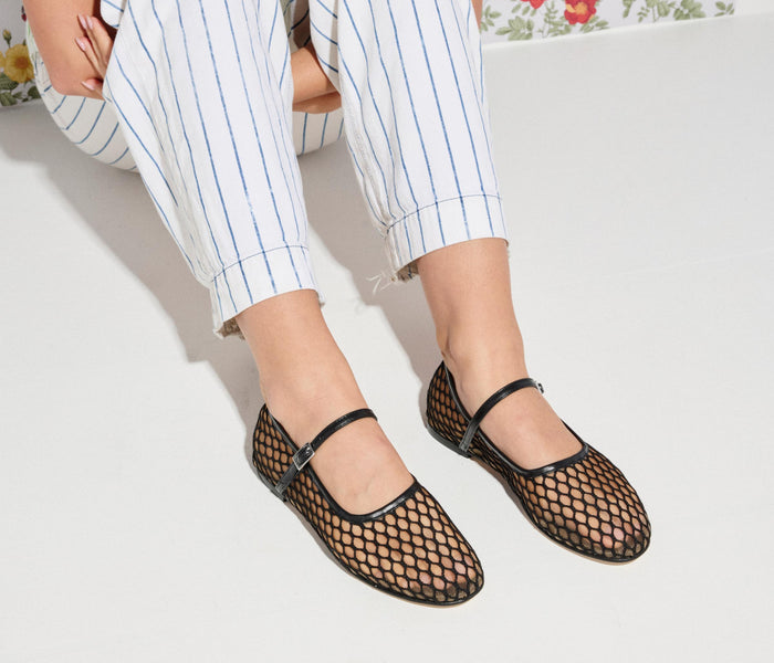 Black Laurel Fishnet Mary Jane flat shoes by Freda Salvador, featuring netting material and classic Mary Jane strap design.