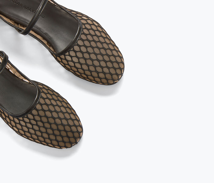 Black Laurel Fishnet Mary Jane flat shoes by FREDA SALVADOR with detailed fishnet pattern and classic strap design.