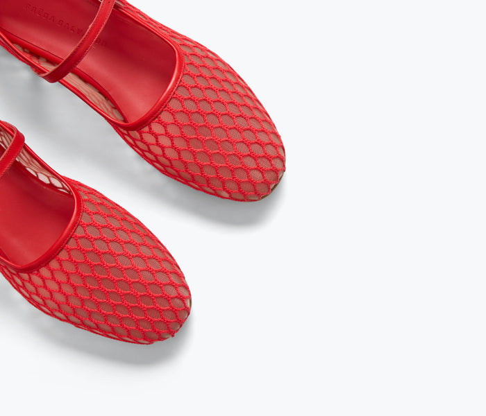 Crimson fishnet Mary Jane flat shoes by FREDA SALVADOR featuring intricate netting detail and classic strap design.