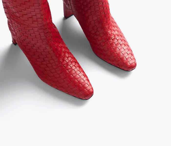Red Lennox Woven Tall Boot by Freda Salvador featuring intricate woven leather design and sleek silhouette.