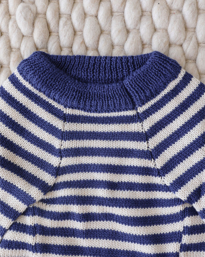 blue striped dog sweater close up stripe detail