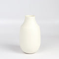 Lilith Rockett Vase with Neck "B" is Reminiscent of an eggshell, this vase is wheel thrown porcelain with gloss glaze on the interior and an unglazed exterior. It has been sanded smooth and it is very stable despite its rounded bottom.