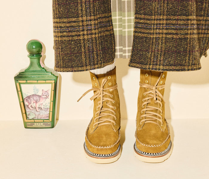 Freda Salvador Lilly lace-up suede boot with chunky heel and stylish design, shown from a side view.
