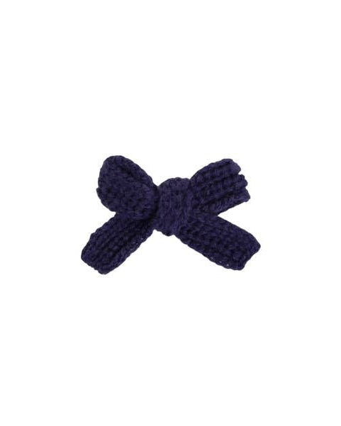Side view of patriotic dog hair bow in red, white, and blue for small dogs.