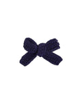 Side view of patriotic dog hair bow in red, white, and blue for small dogs.