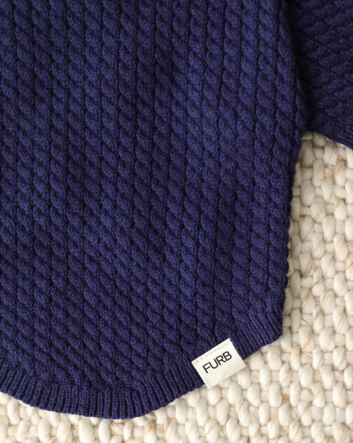 navy dog sweater lifestyle shot cozy cable knit polo style outfit for dogs with sailor inspired details