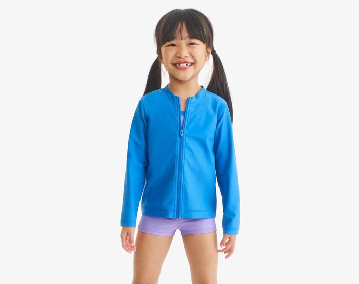 Child wearing Primary Long Sleeve Full-Zip Rash Guard - Blueberry. Available at www.tenlittle.com