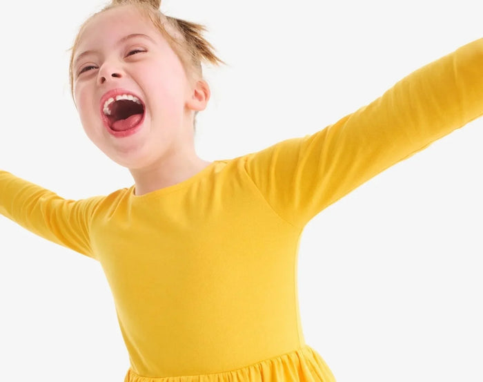 Child wearing Primary Long Sleeve Pocket Dress - Sunflower. Available at www.tenlittle.com