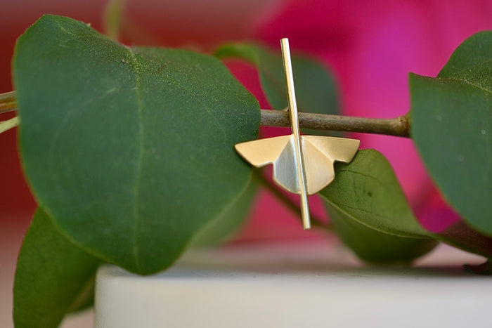 Kaylin Hertel single Lotus Stud earring in 14k yellow gold  is made out of Abstract motif formed from creases of gold balanced on a stick.