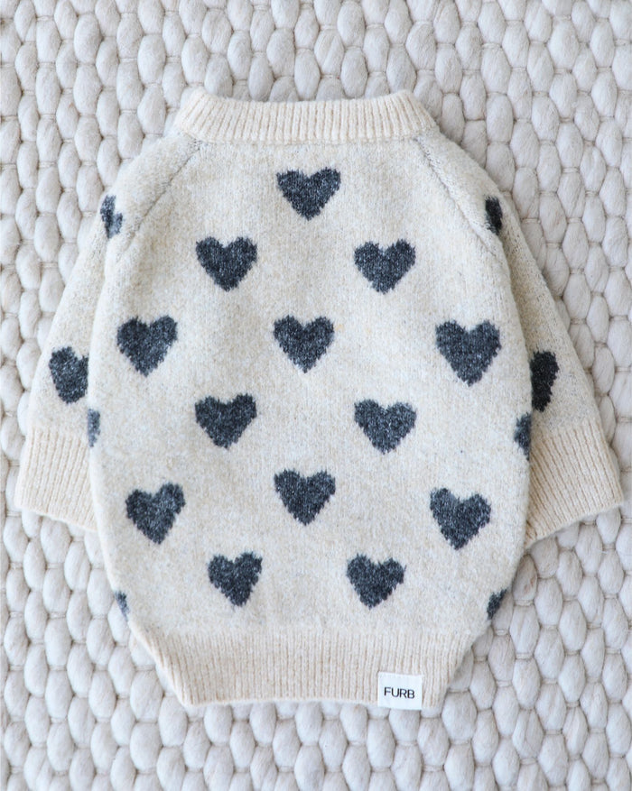 Soft knit dog sweater with an allover heart pattern, ideal for cooler walks and lounging, loved by dachshunds and cavapoos
