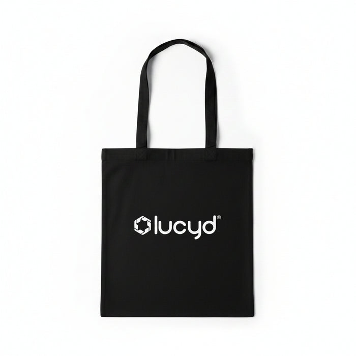 The Lucyd Tote by Lucyd features two handles and a white geometric logo with the word "lucyd" on the front. Sleek, lightweight, and modern, it’s ideal for carrying your everyday essentials.