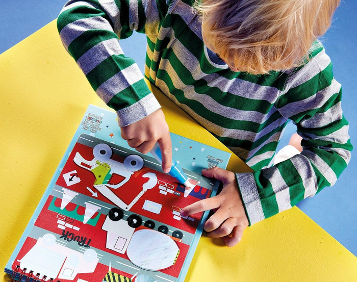 Child playing with Floss & Rock Magic Water Reusable Color In Pad Construction. Available at www.tenlittle.com