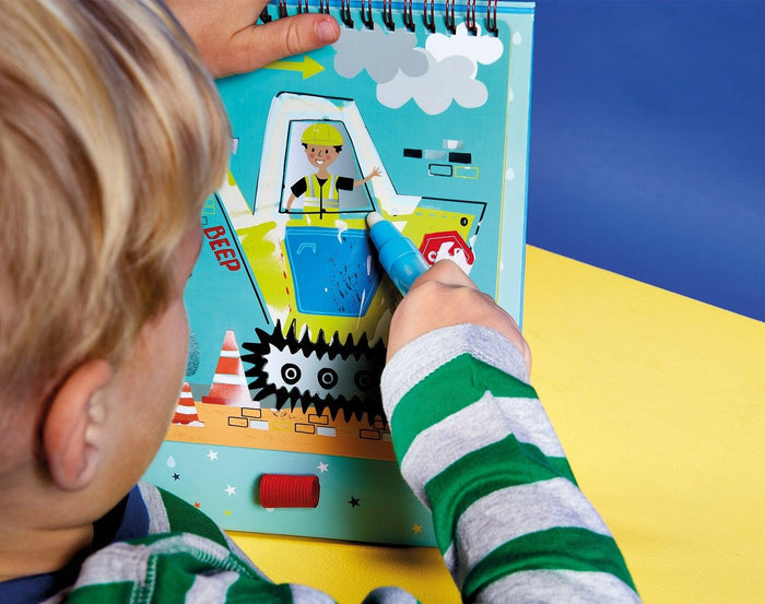 Child drawing on Floss & Rock Magic Water Reusable Color In Pad Construction. Available at www.tenlittle.com